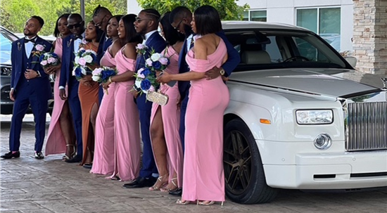 Photo of wedding party with limo