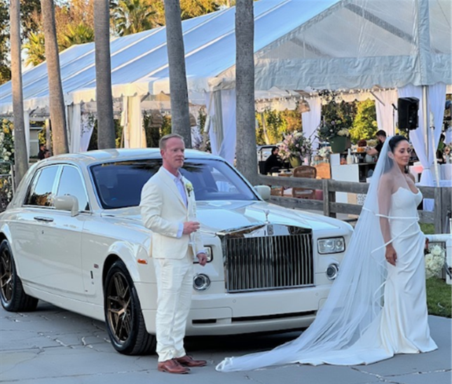 Photo of Bride and Groom with Rolls Royce Phantom Limo